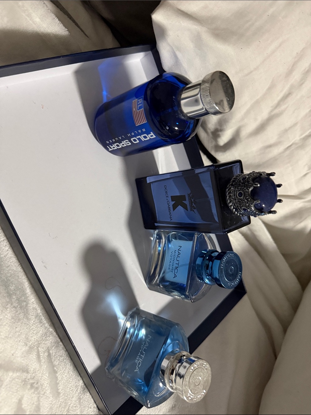 Assorted bottles of men’s cologne Dolce & Gabbana,polo sport and Nautica.